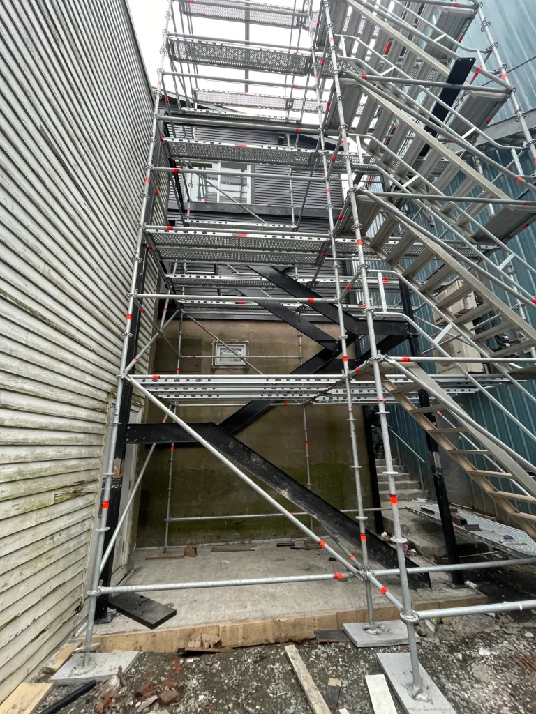 Fire-escape structure during field installation by BriteArc Fabricators