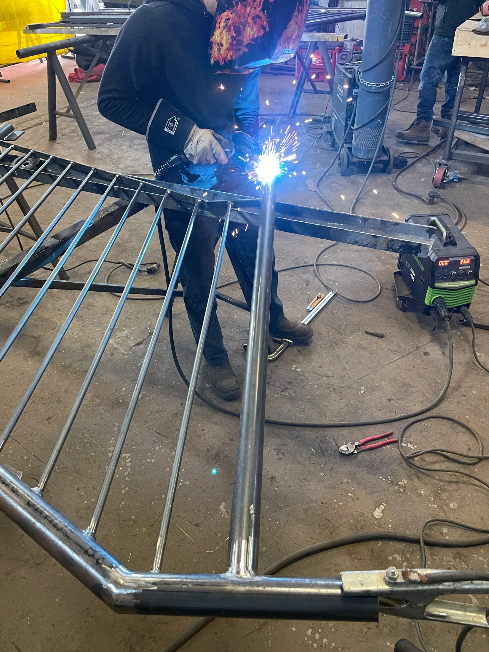 Shop welding on a custom steel railing by BriteArc Fabricators