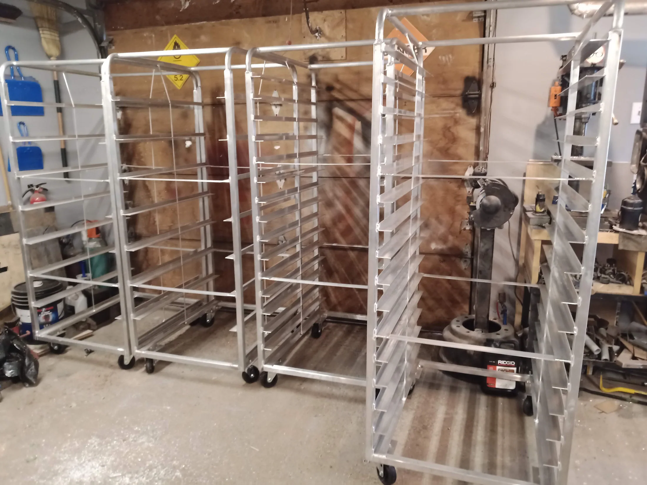 Custom stainless rolling bakery racks by BriteArc Fabricators