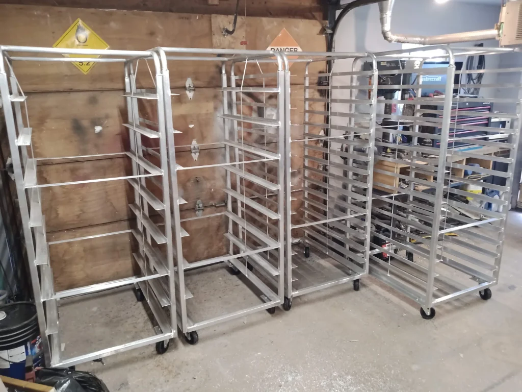 Completed mobile bakery rack assemblies by BriteArc Fabricators