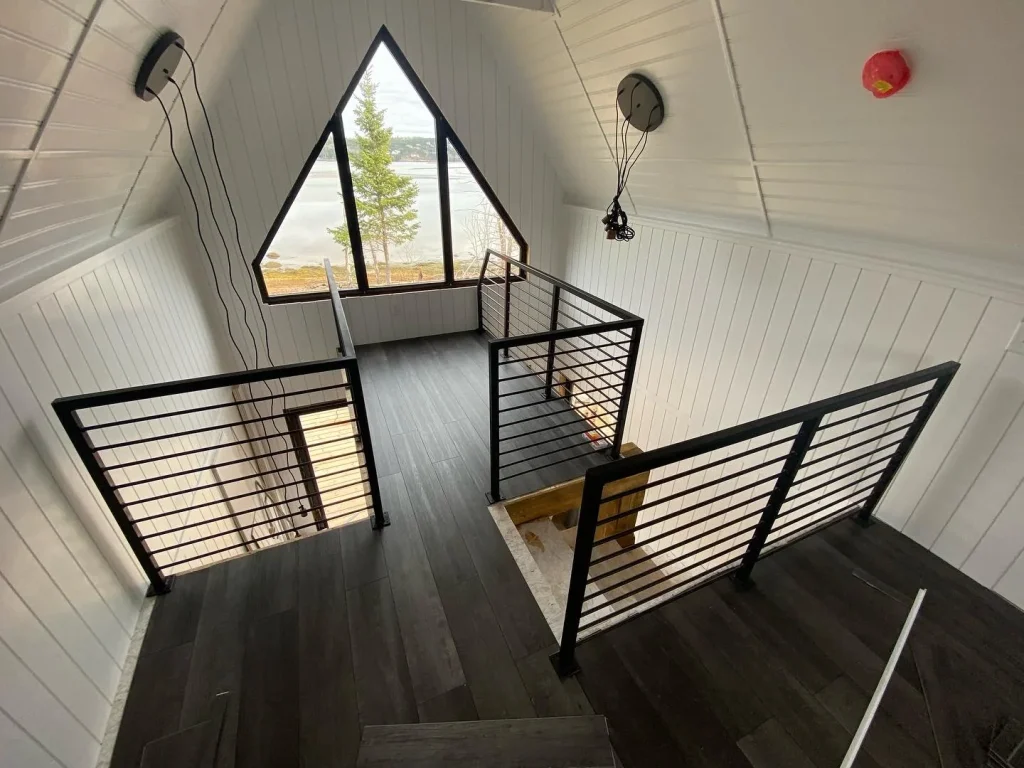 Modern interior horizontal-bar stair guardrails by BriteArc Fabricators