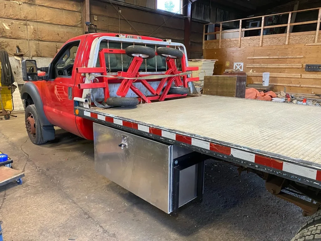 Custom flatbed and toolbox package on a work truck by BriteArc Fabricators