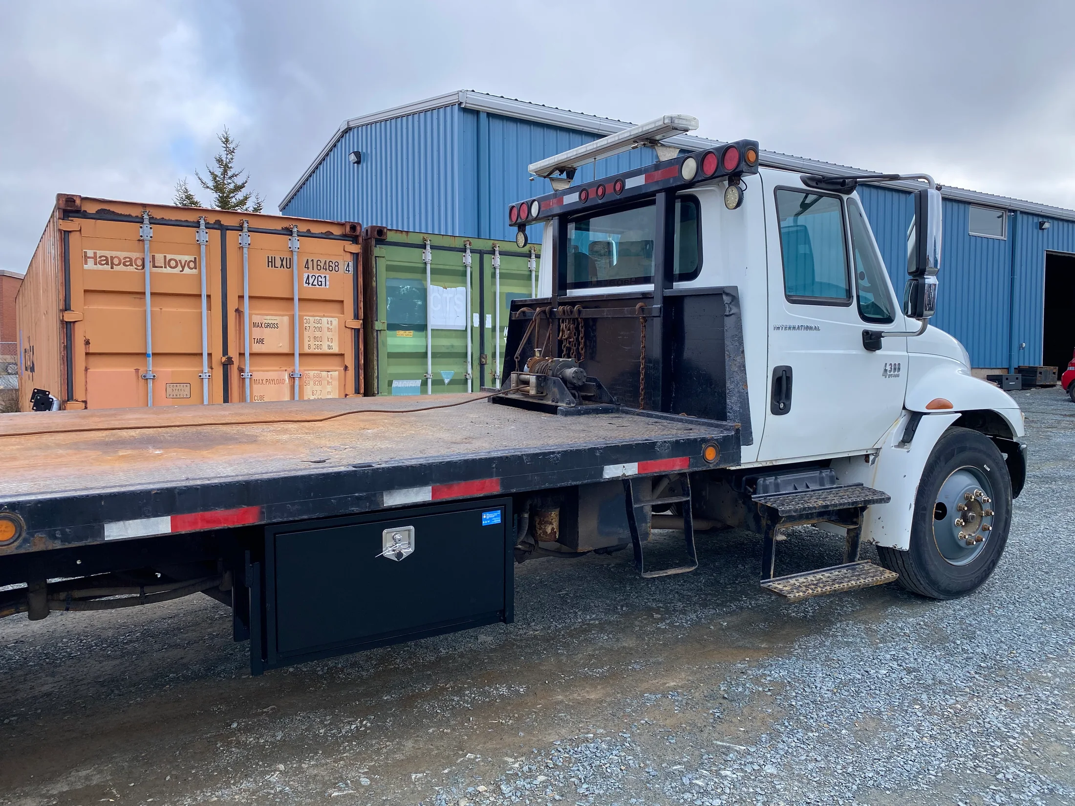 Completed flatbed service truck with integrated storage by BriteArc Fabricators