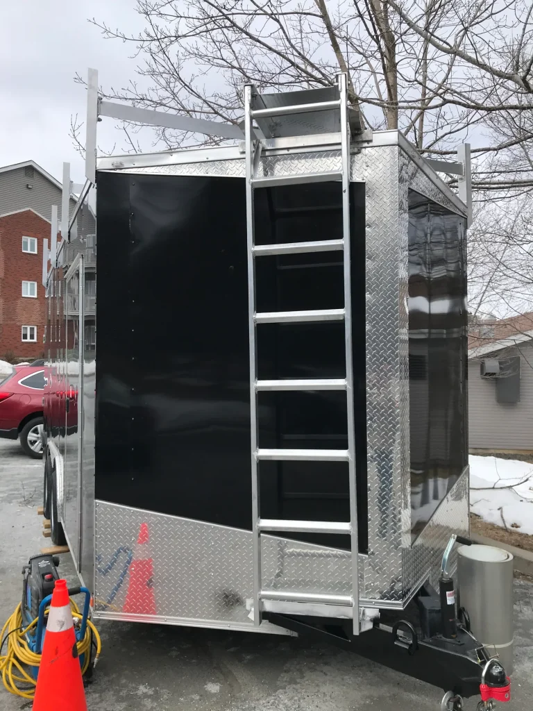 Enclosed utility trailer with fabricated rear ladder by BriteArc Fabricators