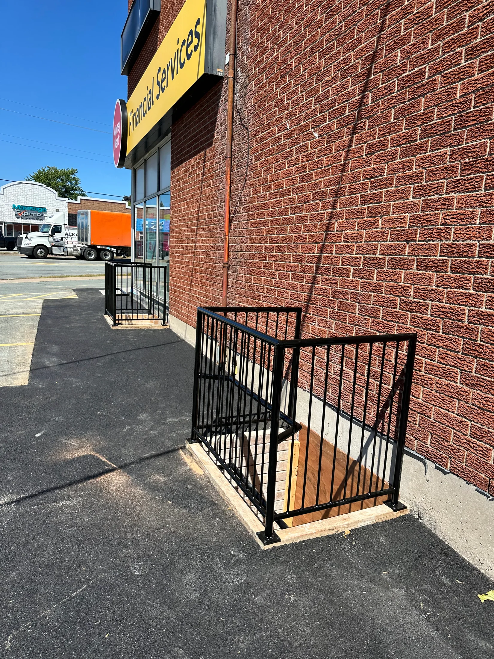 Exterior guardrail installed beside a brick facade by BriteArc Fabricators