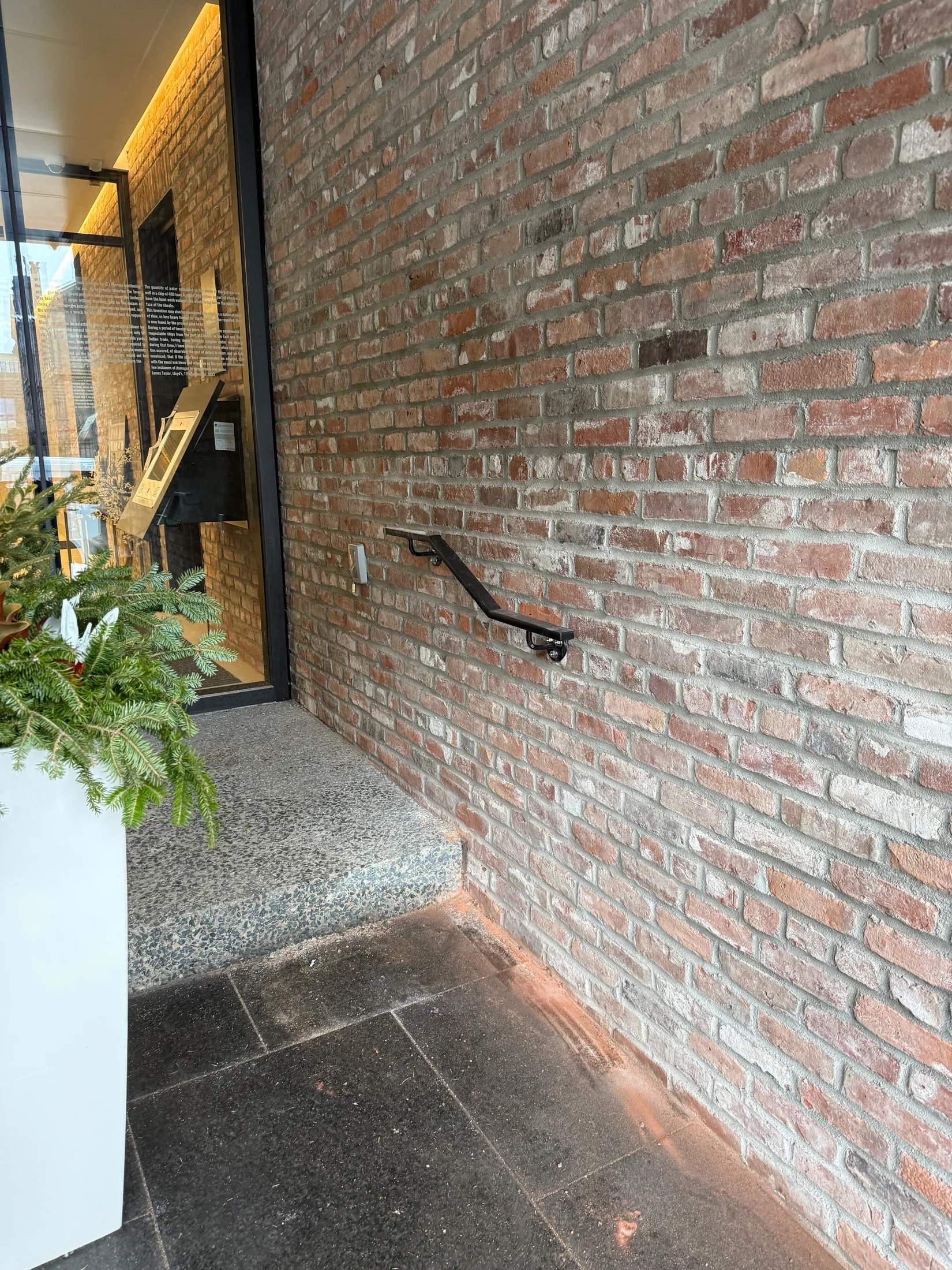 Handrail fitted to an existing brick wall by BriteArc Fabricators