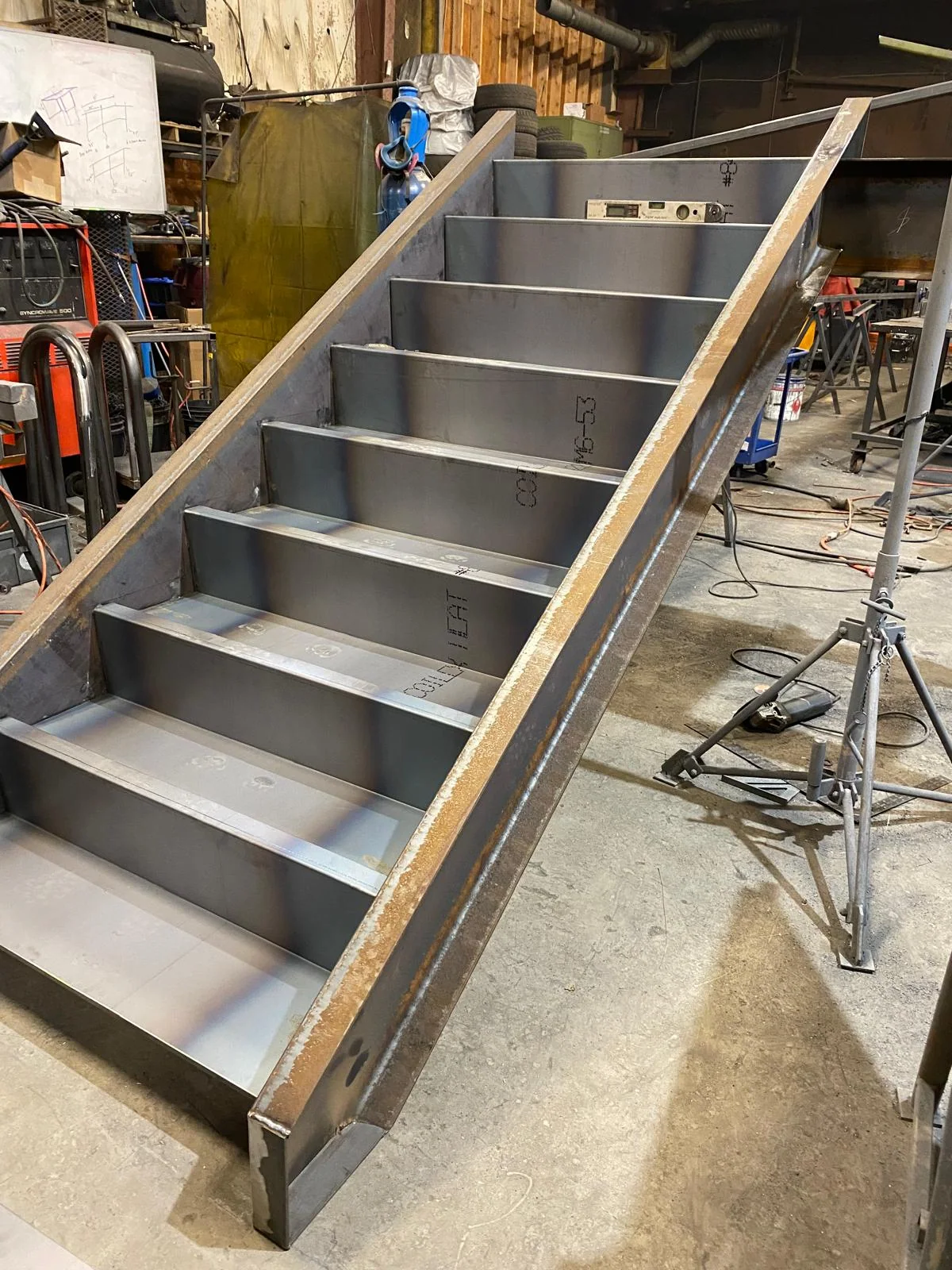 Assembled steel staircase in the fabrication shop by BriteArc Fabricators