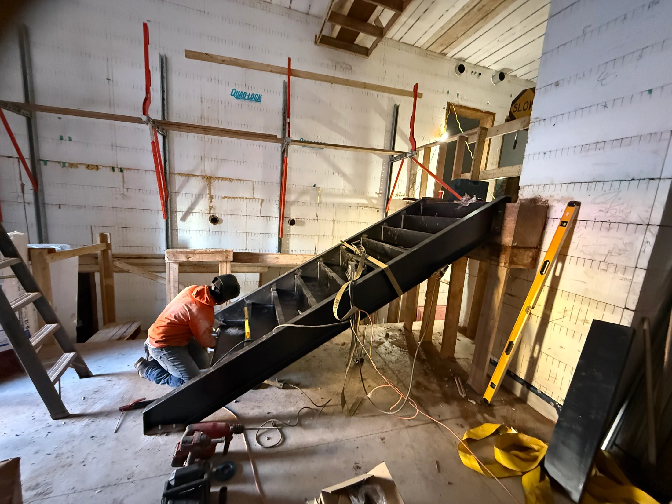 Stair stringer installation at the commercial entrance by BriteArc Fabricators