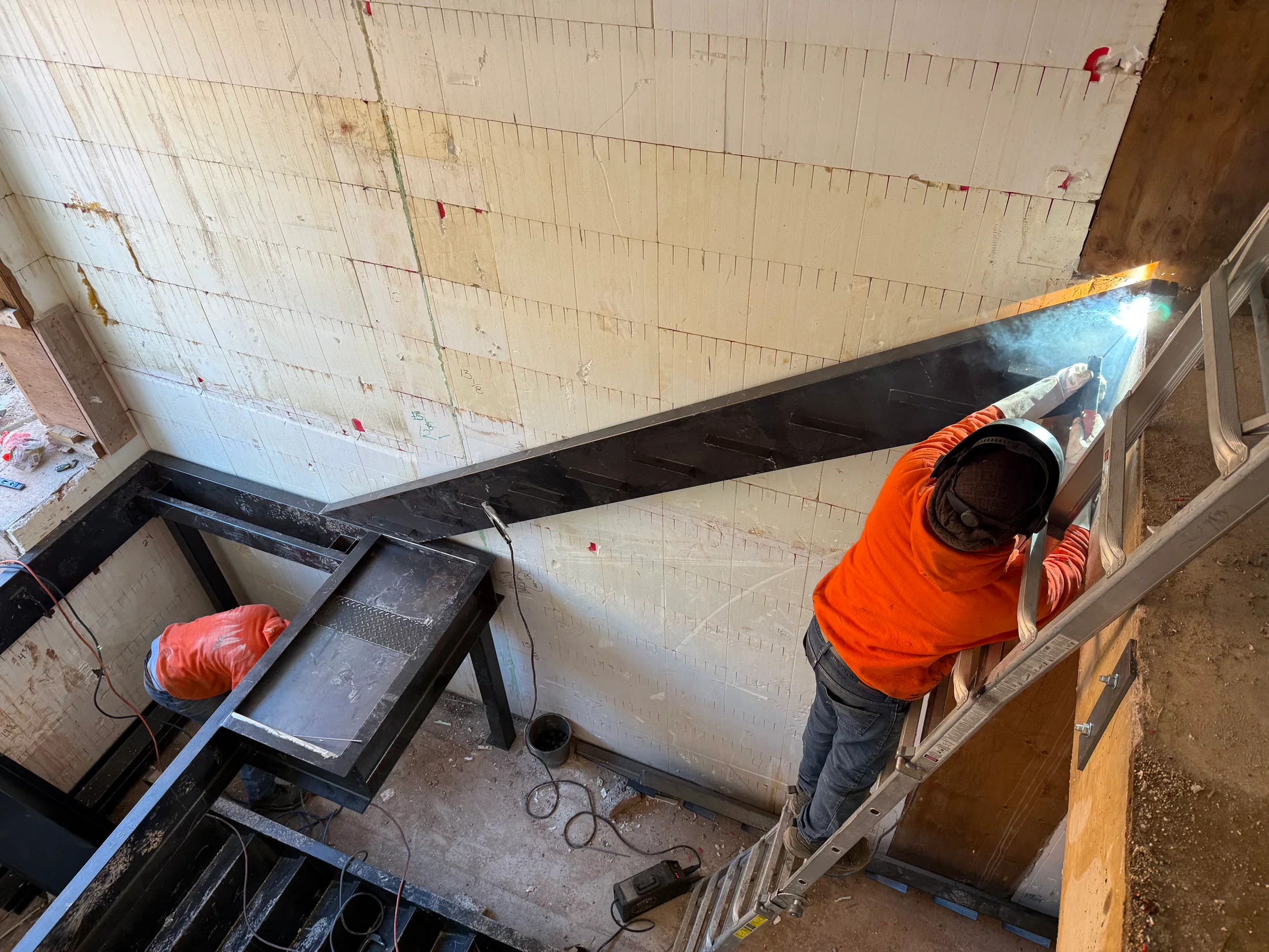 Final fitting around the stair landing frame by BriteArc Fabricators