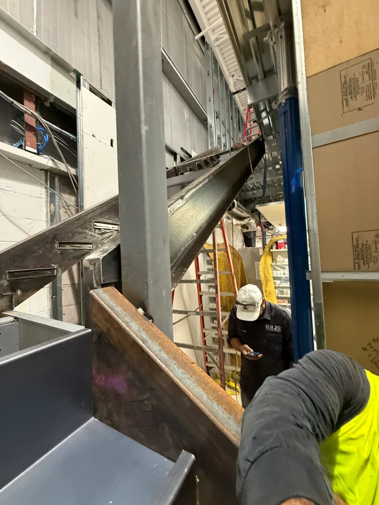 Field work on the steel stair frame by BriteArc Fabricators