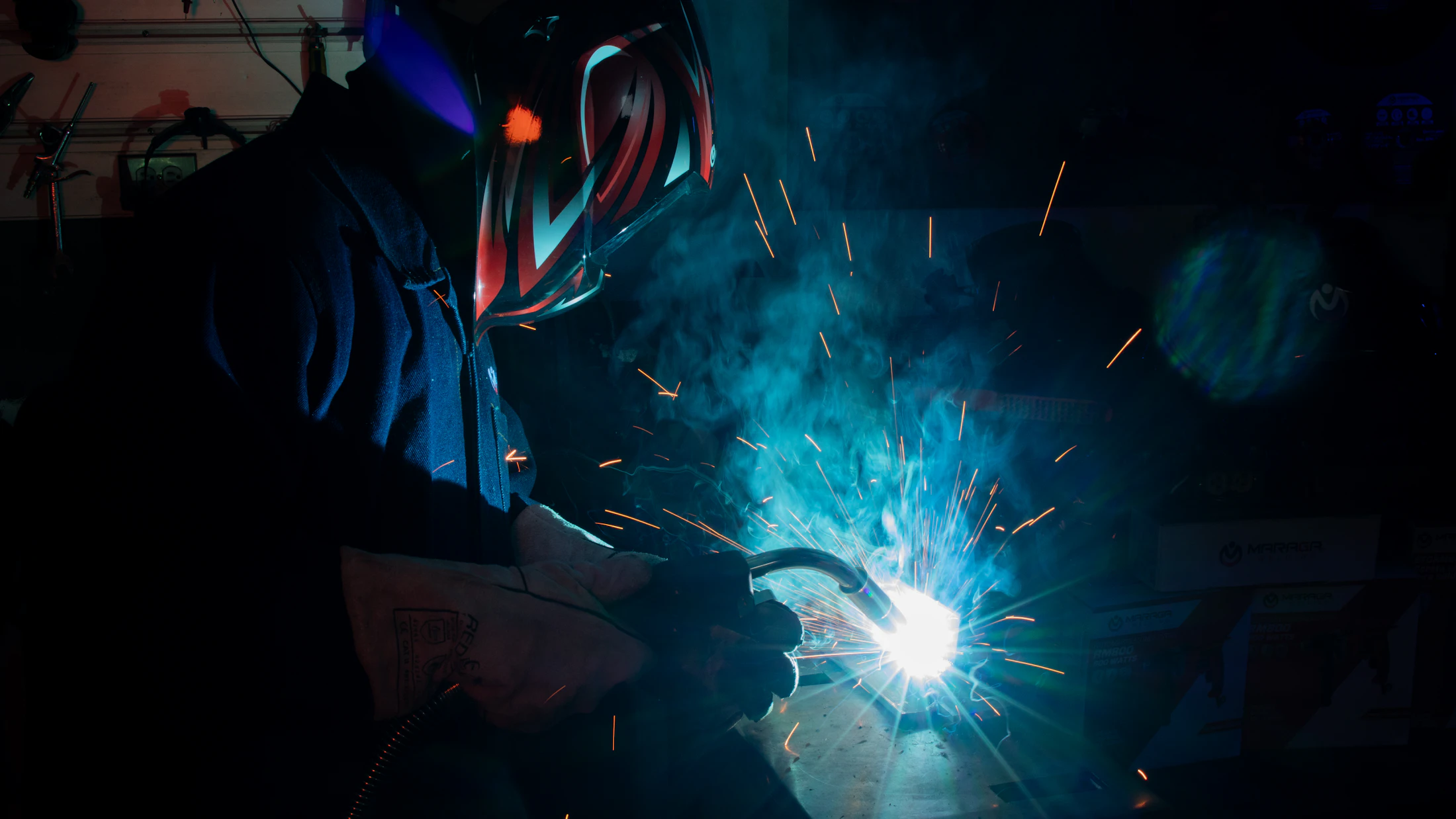 Welder fabricating steel in a workshop