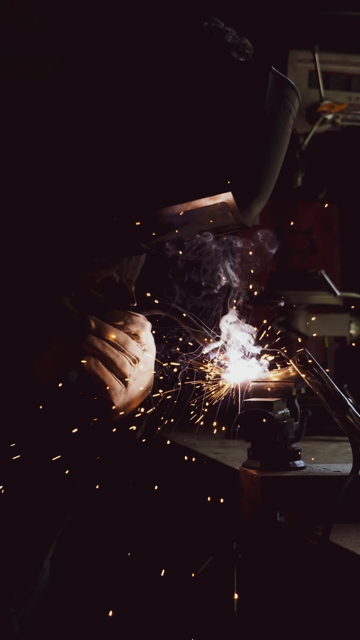Welder fabricating a structural steel assembly