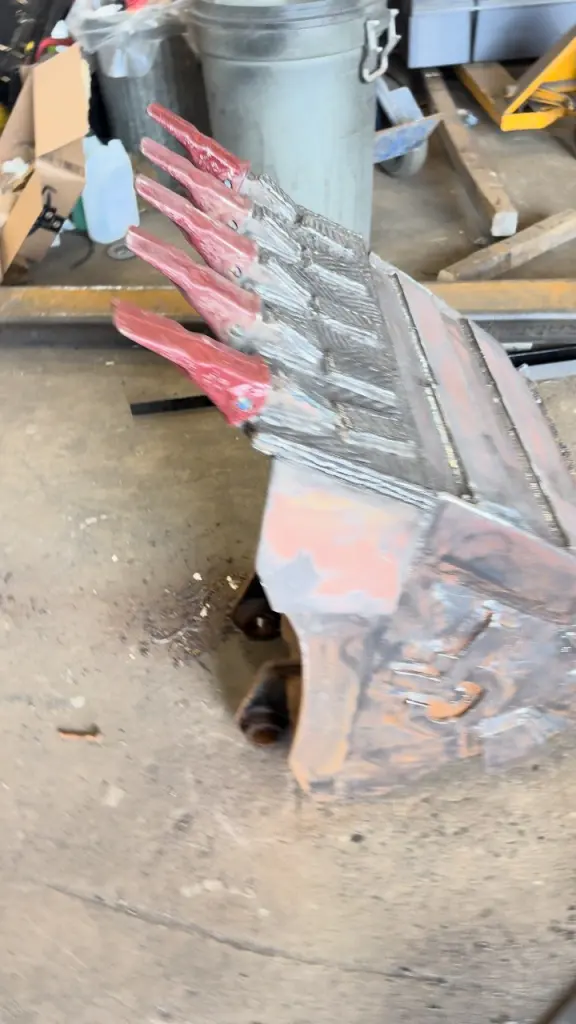 Completed bucket repair walkthrough by BriteArc Fabricators