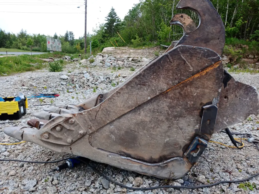 Excavator bucket before wear and reinforcement work by BriteArc Fabricators