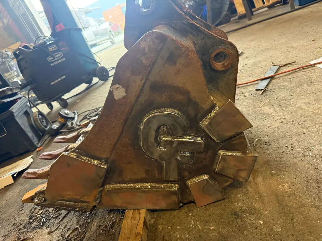 Bucket side plate and pivot reinforcement by BriteArc Fabricators