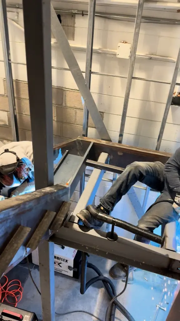 Field fitting during a commercial steel installation by BriteArc Fabricators