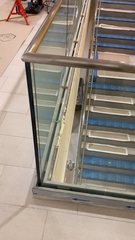 Stainless handrail and glass guard detail by BriteArc Fabricators