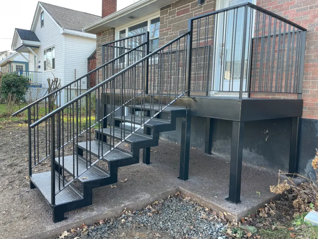 Exterior steel stair, landing, and guardrail assembly by BriteArc Fabricators